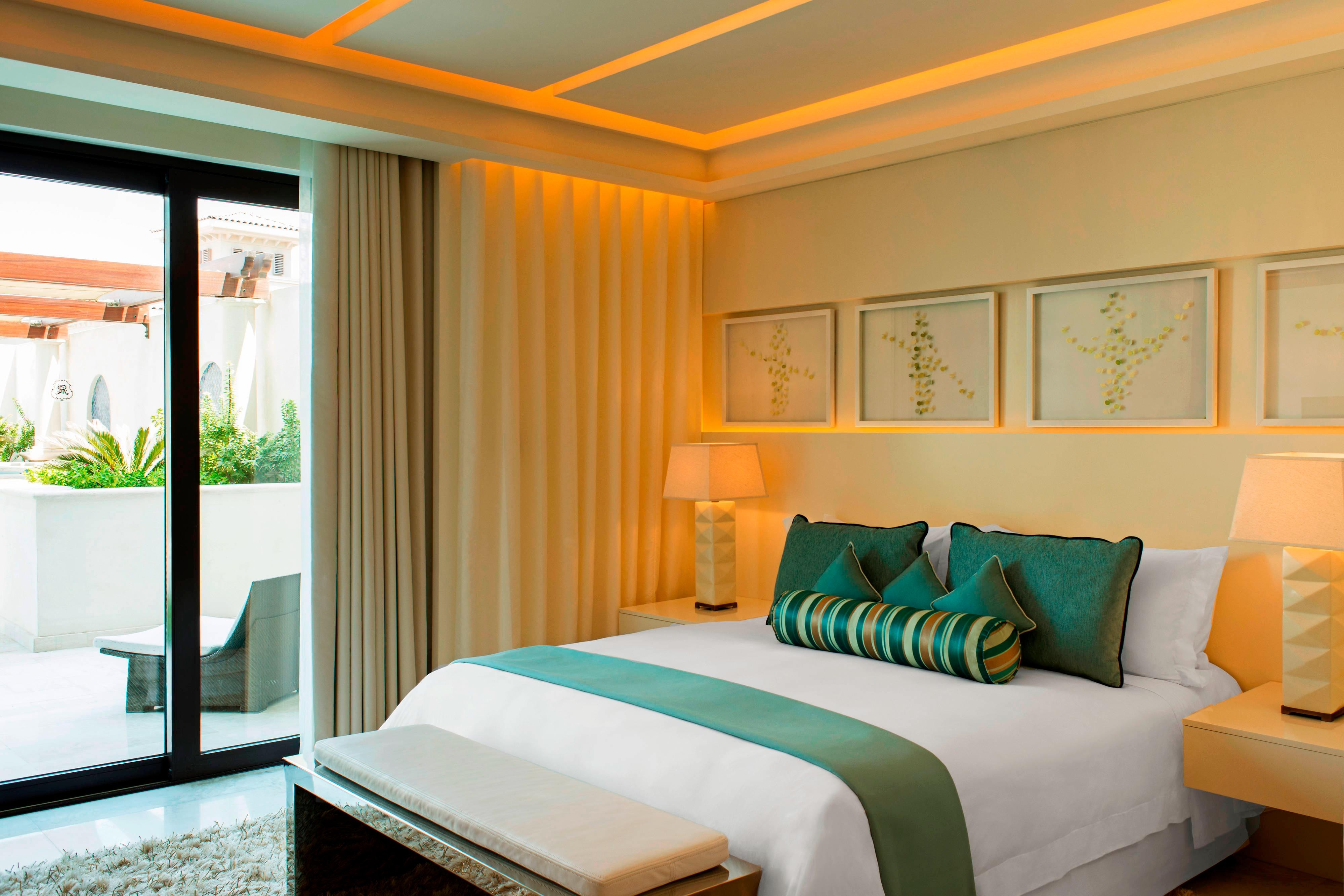 Bright master bedroom with ensuite bath and terrace views at St. Regis Villas