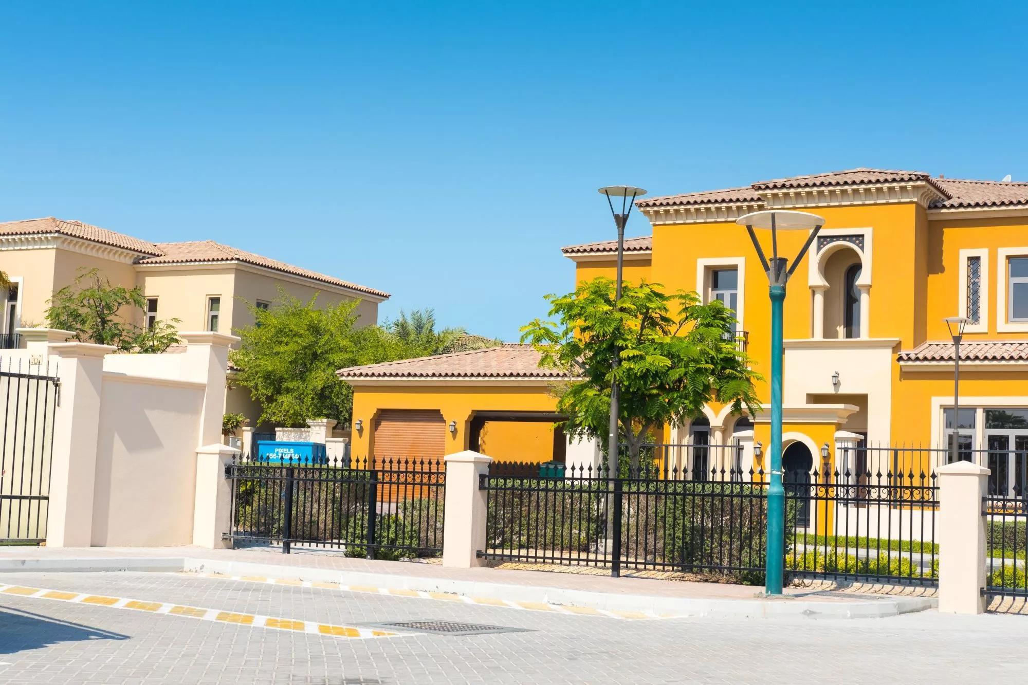Elegant villa exterior with landscaped gardens and secure parking at Saadiyat Beach Villas